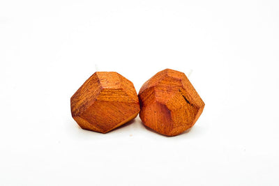 Pair of small faceted geometric stud earrings in rich red Chakte Kok wood with sterling silver posts, hand-finished matte surface.