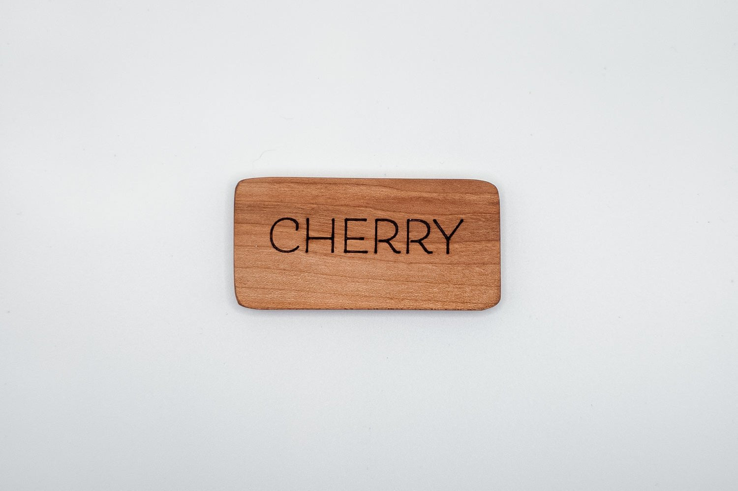 Cherry wood jewelry by PRWMade featuring warm reddish-brown tones that deepen with age