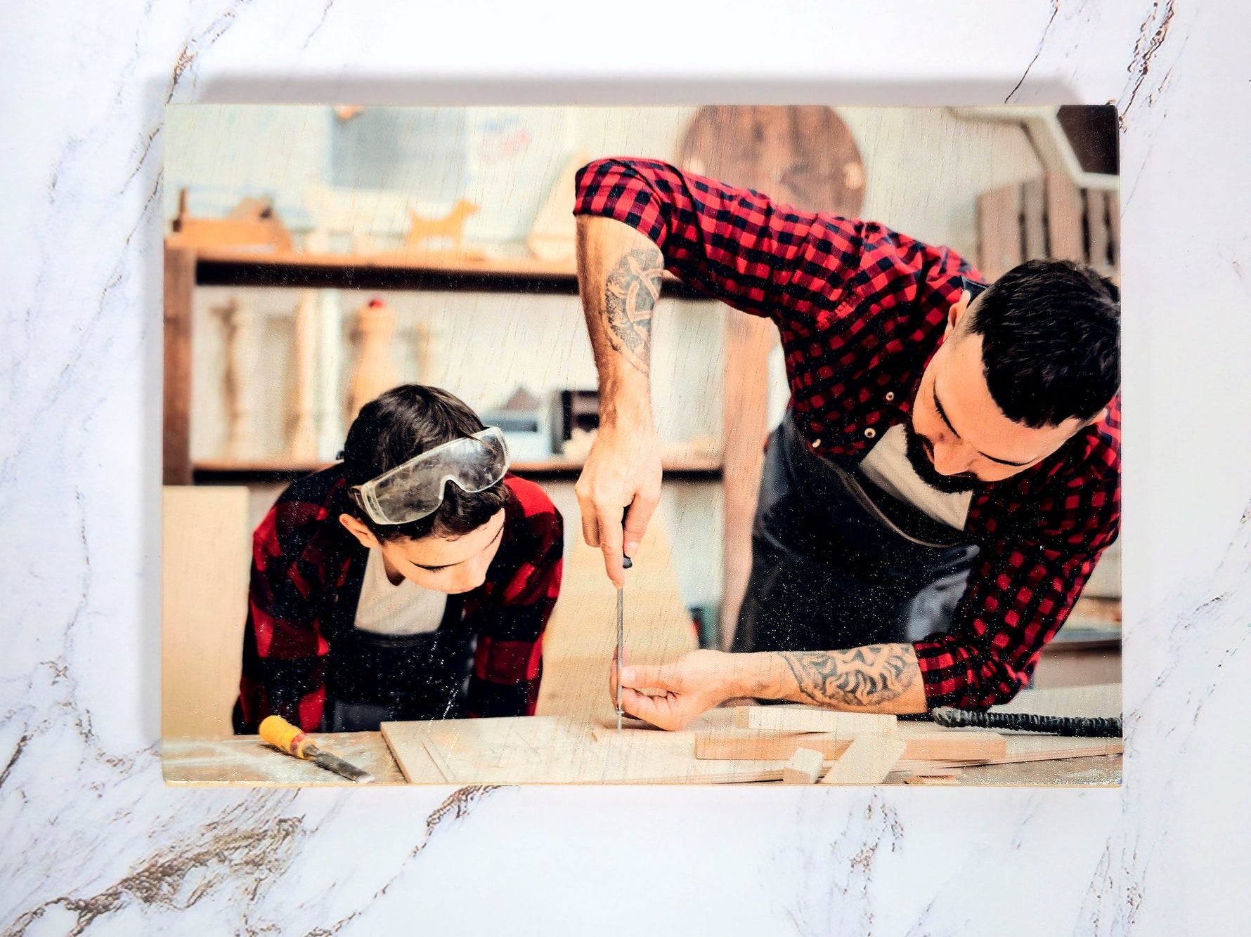Father-and-son carpentry portrait printed on 6x6 Baltic birch panel (5x7 sample shown)