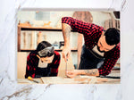 Father-and-son carpentry portrait printed on 8x8 Baltic birch panel (5x7 sample shown)