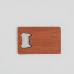 Cherry wood veneer wallet bottle opener with left-side metal opener, rectangular shape, smooth finish, natural cherry color.