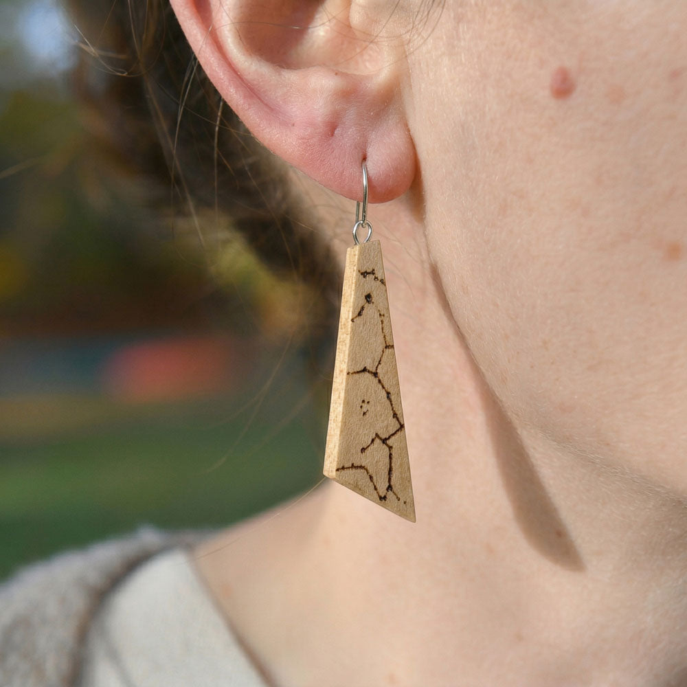Personalized olivewood Ascent earrings with star chart engraving and geometric burnt design, handcrafted from sustainable wood.