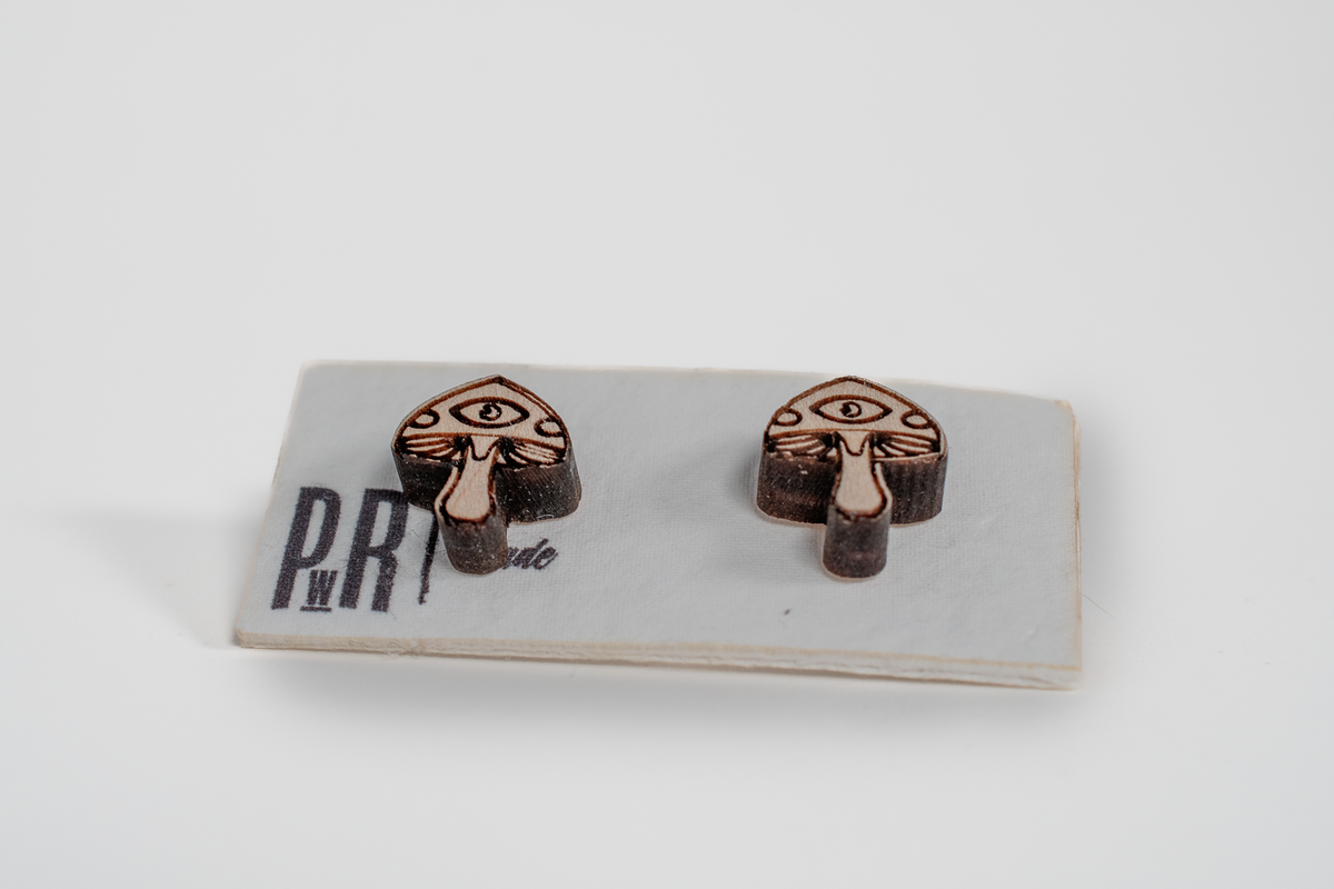Handcrafted maple wood stud earrings with geometric shapes, natural finish, displayed on a white PRW Made card.