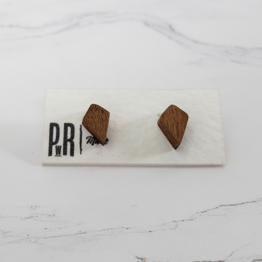 Fire wood stud earrings made from laser-engraved wood, flame-shaped with natural finish, shown on PRW Made display card.