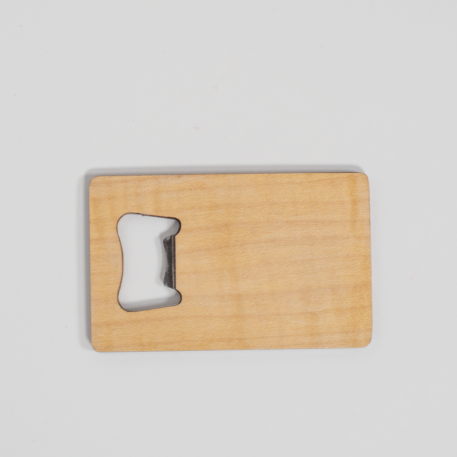 Maple wood veneer bottle opener with visible metal edge, rectangular shape, smooth finish, displayed on a white background.