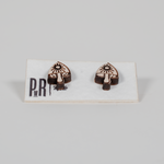Handcrafted mushroom-shaped wooden stud earrings with black geometric laser engraving, displayed on a branded PRW Made card.