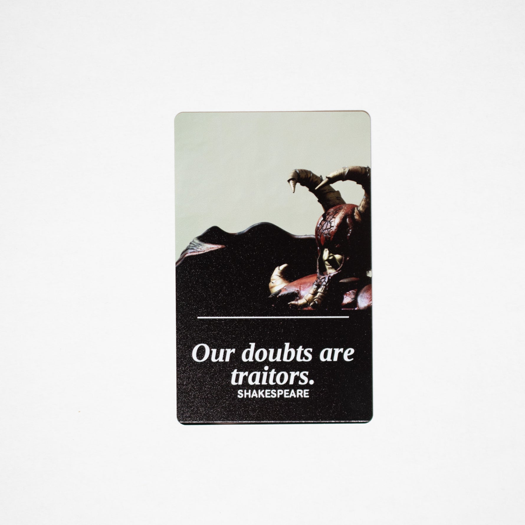 Our Doubts metal bookmark, Shakespeare quote on black aluminum with horned figurine photo