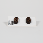 Walnut wood Small Stud Earrings with laser-engraved geometric patterns, dark brown finish, shown on a white PRW Made display card.