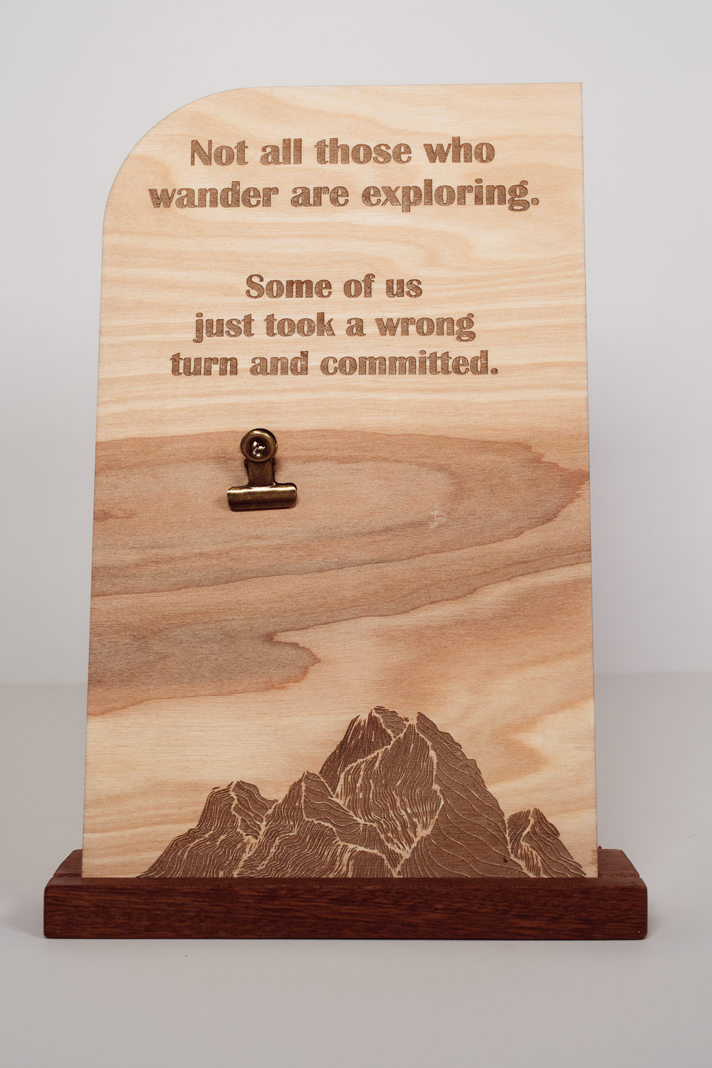 Laser-engraved wooden message board with mountain design, engraved text, clip holder, and handmade upright wood stand.