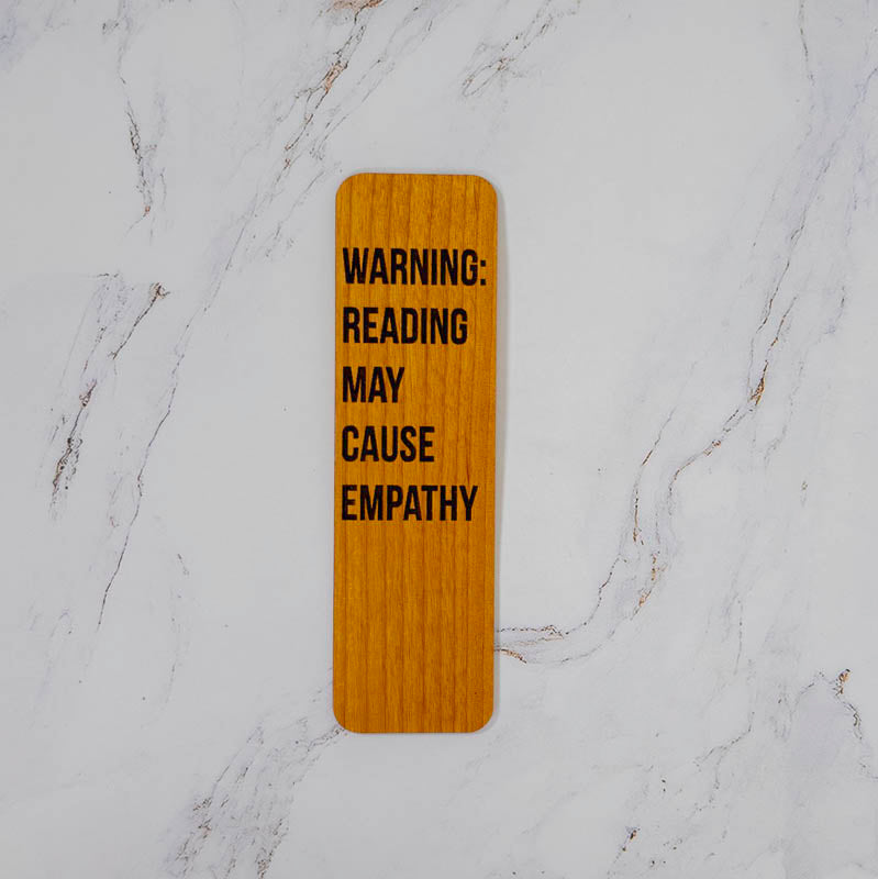 Cherry wood bookmark engraved Warning: Reading May Cause Empathy in bold filled type, handmade in Ohio by PRWMade
