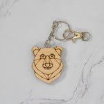 Geometric bear head wood keychain laser cut and engraved from maple with low-poly line art, silver clasp and split ring, handmade in Ohio by PRWMade