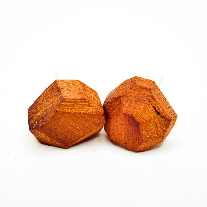 Pair of small faceted geometric stud earrings in rich red Chakte Kok wood with sterling silver posts, hand-finished matte surface.