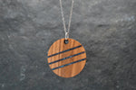 Round wood and stone inlay pendant in Walnut with crushed Lapis Lazuli, sterling silver chain