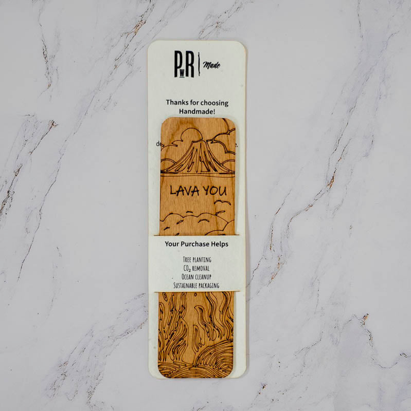 Lava You wooden bookmark in PRWMade recycled packaging showing the tree planting, CO2 removal and ocean cleanup giving-back callouts