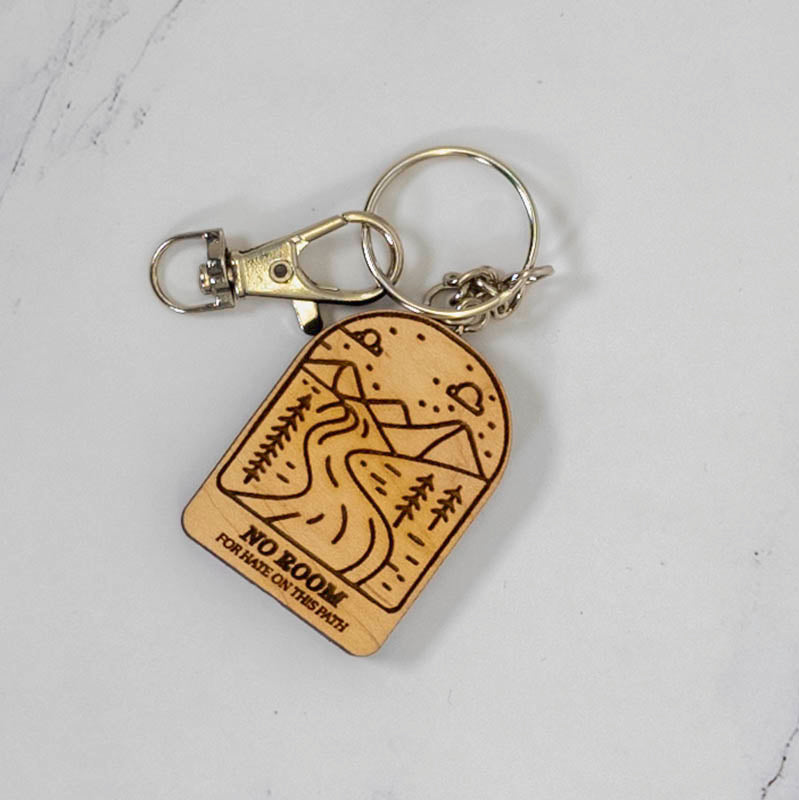Maple arch wood keychain laser engraved with a mountain, pine trees and trail scene, silver clasp and split ring, handmade in Ohio by PRWMade