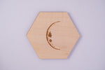 Lunar cycle animation of maple hexagon moon phase coasters, waxing from crescent through full moon and back, laser engraved by PRWMade