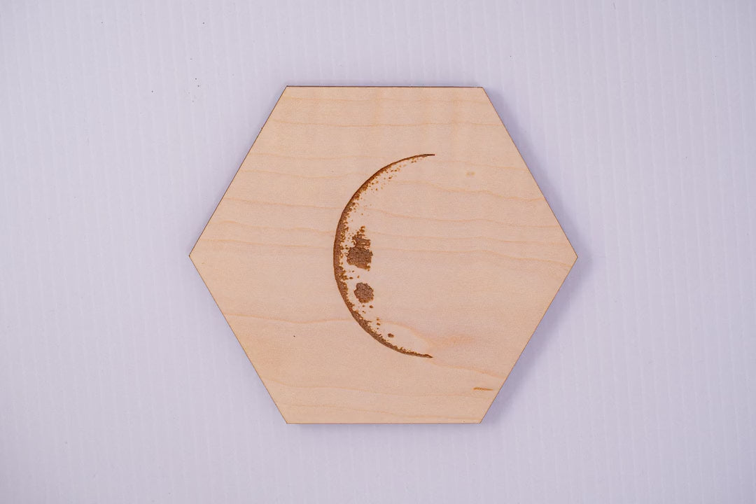 Lunar cycle animation of maple hexagon moon phase coasters, waxing from crescent through full moon and back, laser engraved by PRWMade