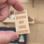 Warning reading may cause empathy maple wood sticker
