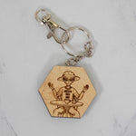Maple hexagon wood keychain laser-engraved with a retro Area 51 alien design, silver clasp and split ring, handmade in Ohio by PRWMade