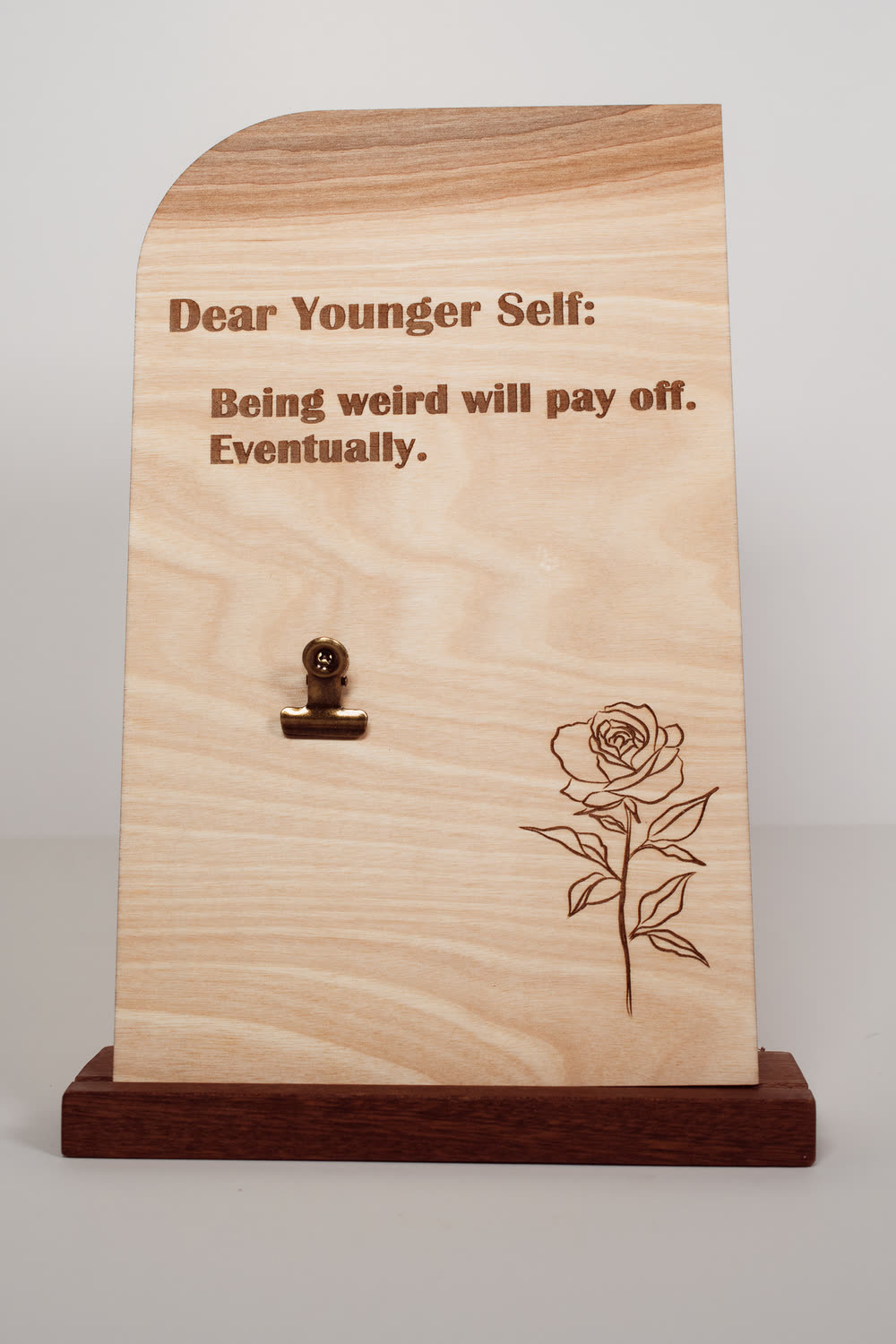 Wooden message board with clip engraved Dear Younger Self: Being weird will pay off, eventually, with a rose design, handmade wood desk sign
