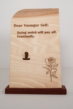 Wooden message board with clip engraved Dear Younger Self: Being weird will pay off, eventually, with a rose design, handmade wood desk sign